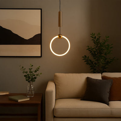 Gold metal ring pendant light creating warm ambient lighting above sofa in a modern living room setting.