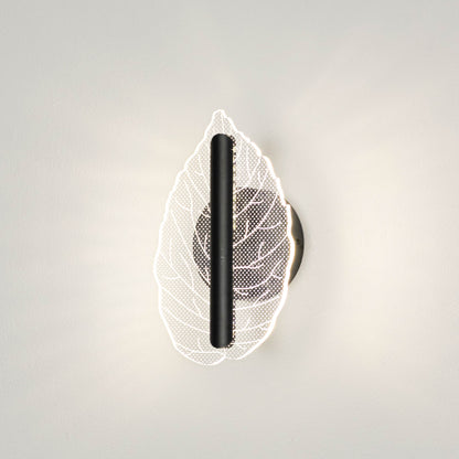 Contemporary wall light with leaf design in metal finish for bedroom or living room decor lighting placement white background.