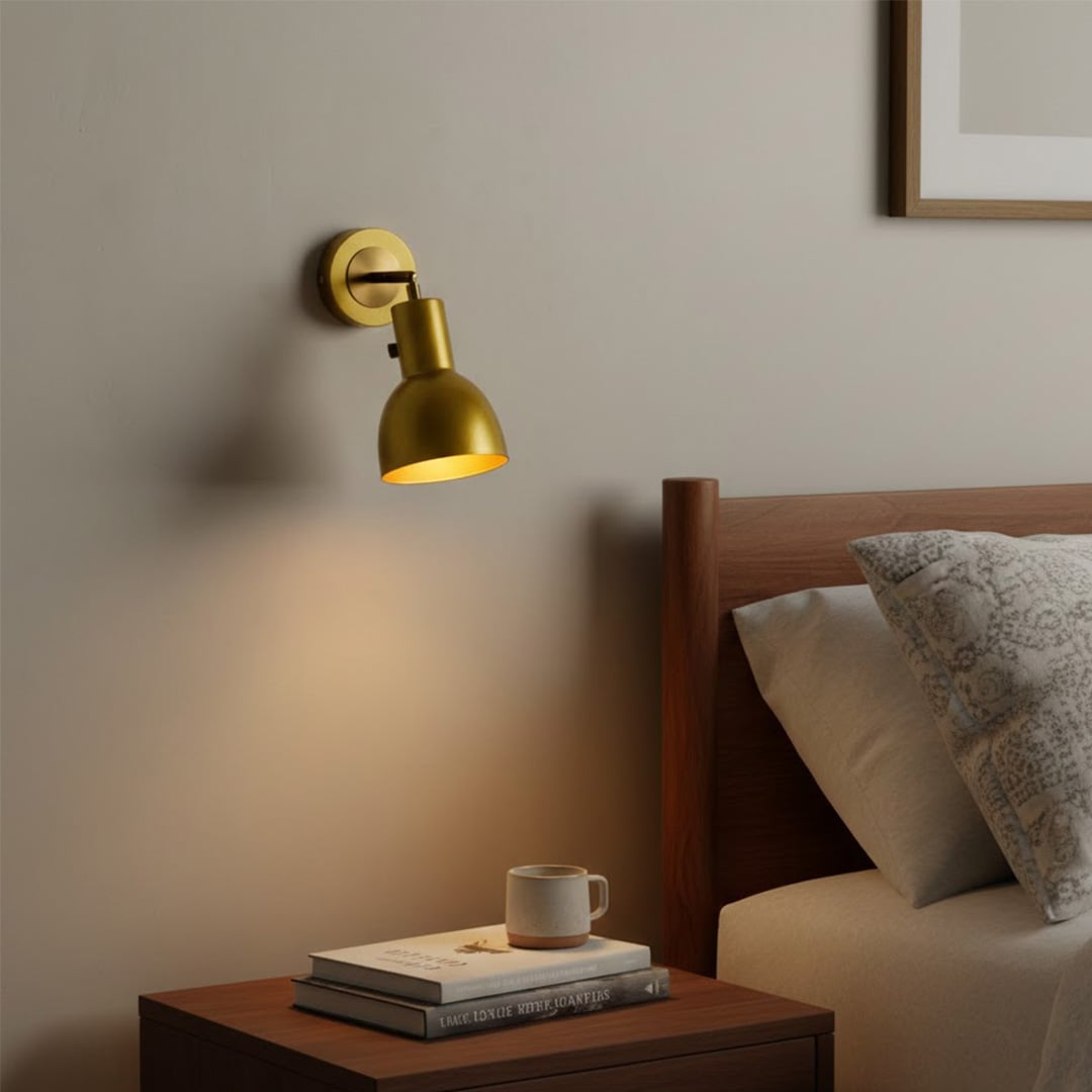 Modern gold metal bedside wall light with warm glow for elegant bedroom and luxury decor styling spaces.