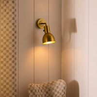 Lifestyle image of gold leonardo metal wall light for elegant hallway decor styling and modern home interior lighting.