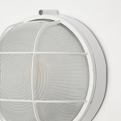 Closeup image of white metal wall light for modern interior decor styling with elegant industrial finish display.
