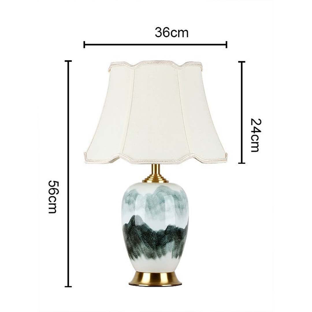 Table lamp light off with white shade and artistic base shown with dimensions 56cm height and 36cm width for product detailing