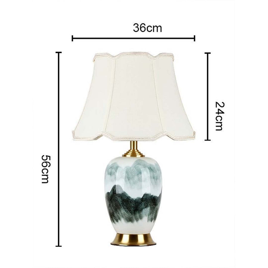 Table lamp light off with white shade and artistic base shown with dimensions 56cm height and 36cm width for product detailing