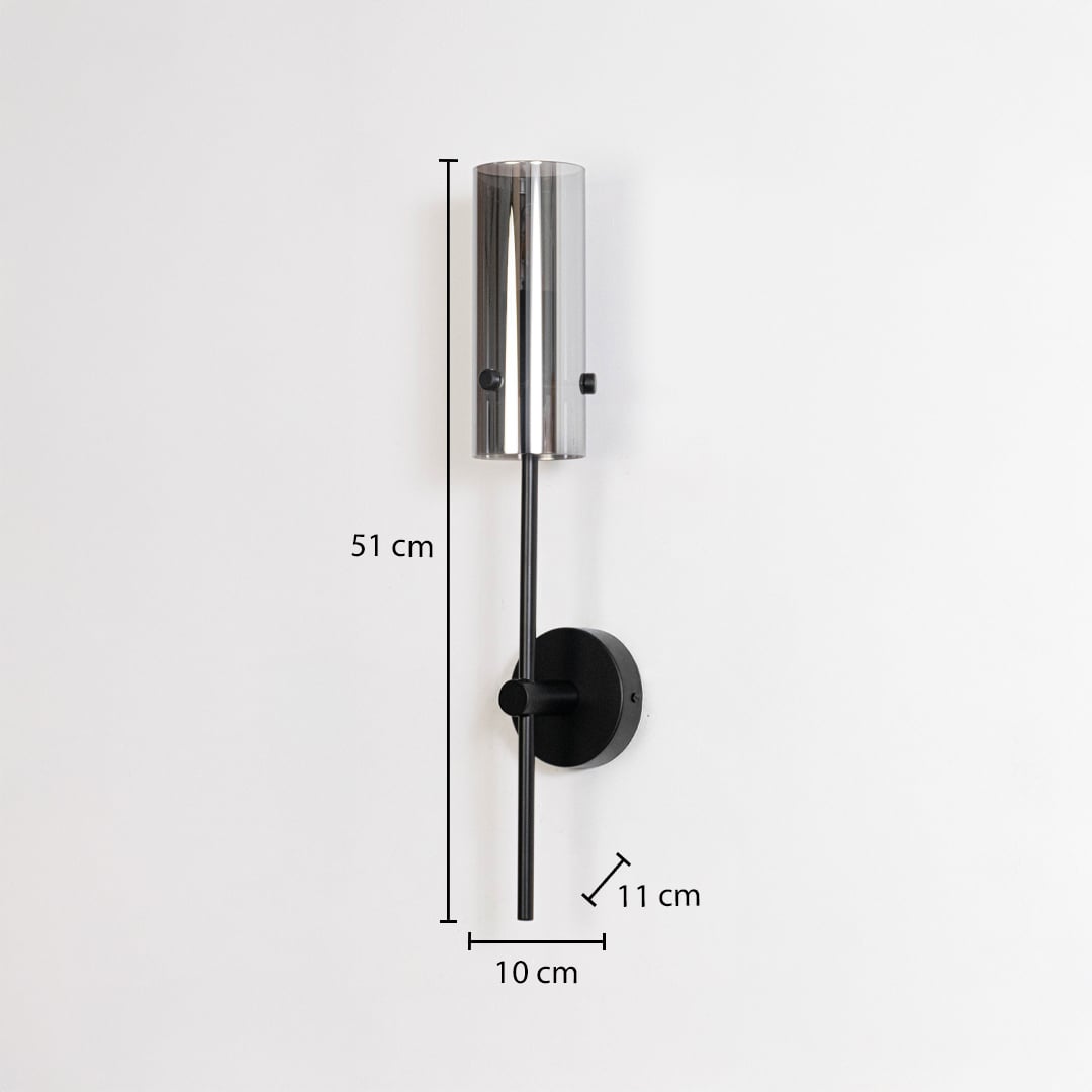 Black wall sconce with cylindrical glass shade shown with size 51 cm height 10 cm width 11 cm depth for accurate fitting view.
