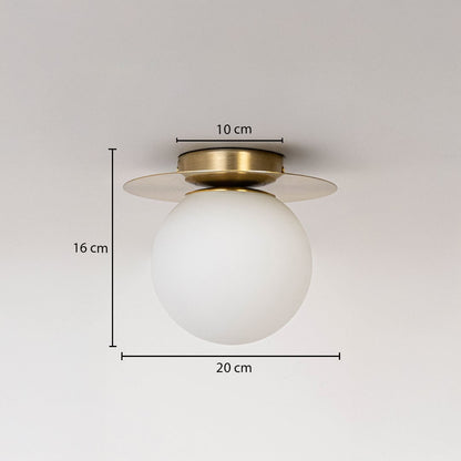 Ceiling light with brushed gold base and frosted glass globe shown with size dimensions 16 cm height 20 cm width and 10 cm base.