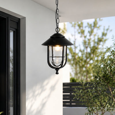 Traditional black metal outdoor wall lantern for porch entrance garden and exterior walls with warm ambient lighting.