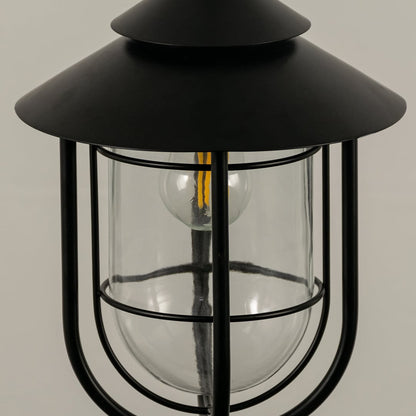 A closeup view of the outdoor hanging lantern showing the smooth metal finish and clear rounded glass panels highlighting the craftsmanship.