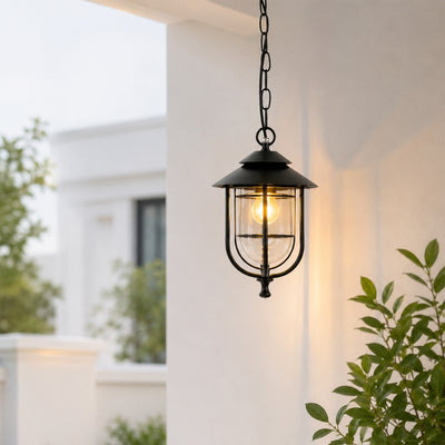 Black metal outdoor hanging lantern for porch entrance balcony and covered patio with warm ambient lighting.