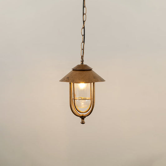 A classic hanging lantern with the light on showcasing its clear glass panels and curved metal frame against a simple white background for product detailing.