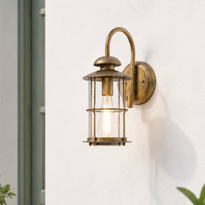 Vintage brass metal outdoor wall lantern for porch entrance balcony and exterior walls with warm ambient lighting.