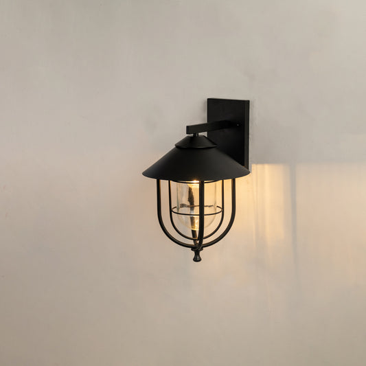 Black metal outdoor wall light on white background with cage design for modern exterior lighting decor.