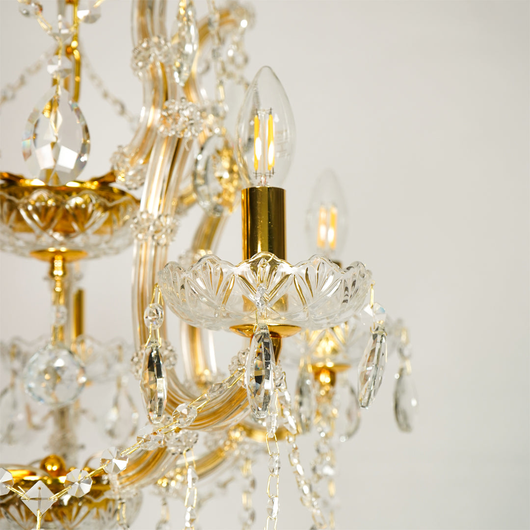 Closeup image of clear glass arm chandelier for modern dining room decor styling with elegant glass detailings.