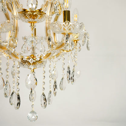 Closeup image of clear glass arm chandelier for elegant living room decor styling with beautiful glass accents.