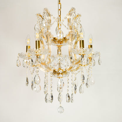 White background image of clear glass arm chandelier for elegant dining room decor styling with unlit glass arms.