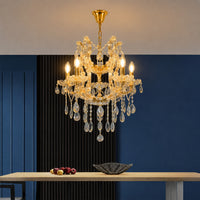 Lifestyle image of clear glass arm chandelier for luxury living room decor styling with elegant glass detailing.
