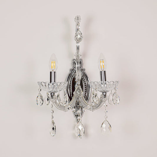 Silver crystal wall light displayed on white background ideal for classic bright interior wall styling.