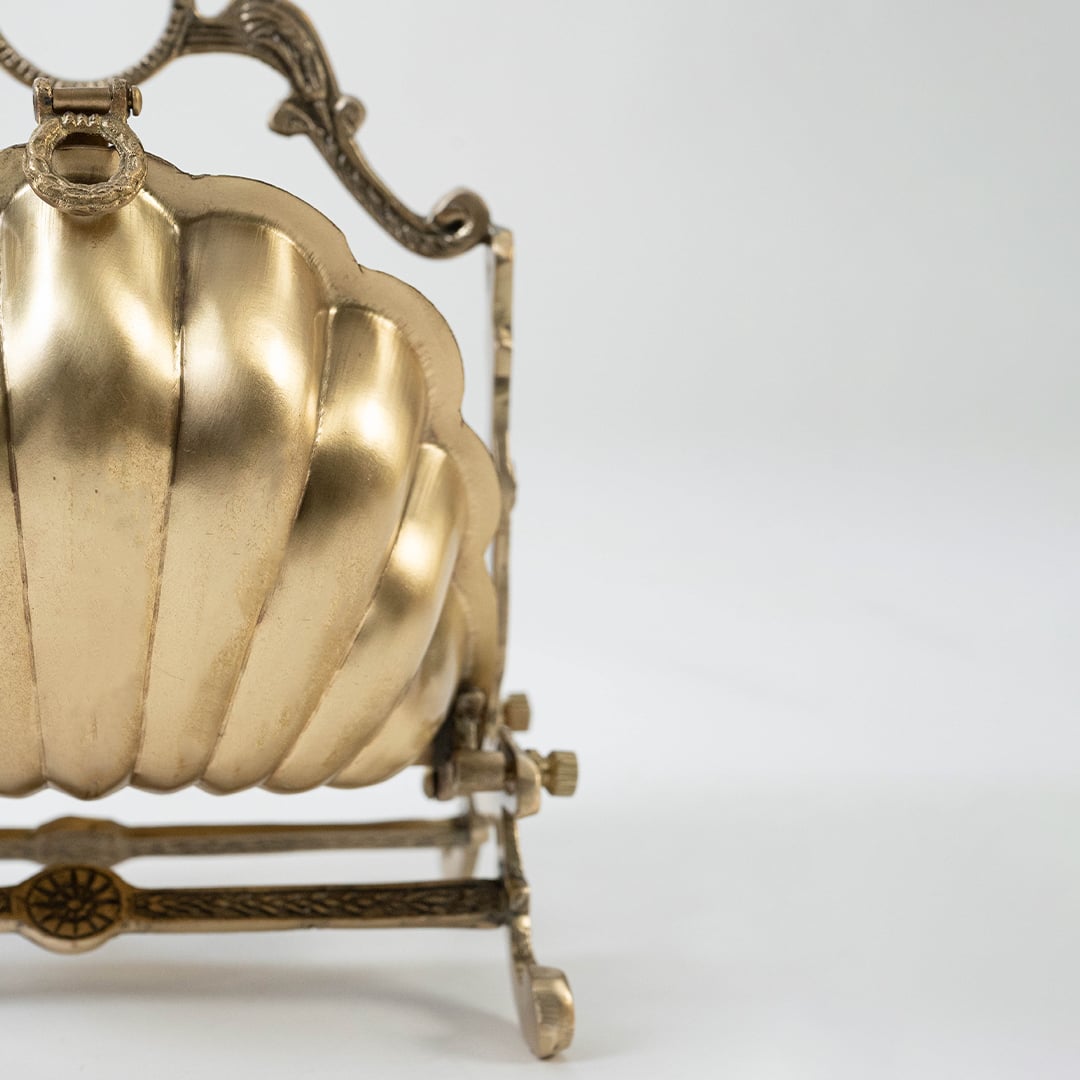 Detailed closeup view of the intricate latticework and ribbed shell texture on the antique gold brass holder highlighting the craftsmanship quality.