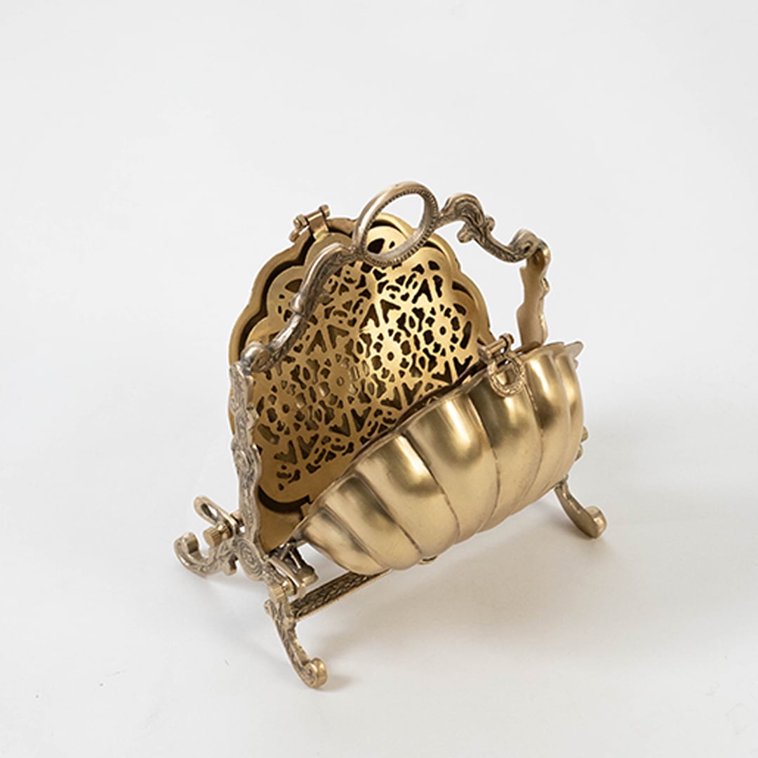 Open antique brass folding stand with intricate jali work and shell exterior isolated on a clean white background for clear product visibility.