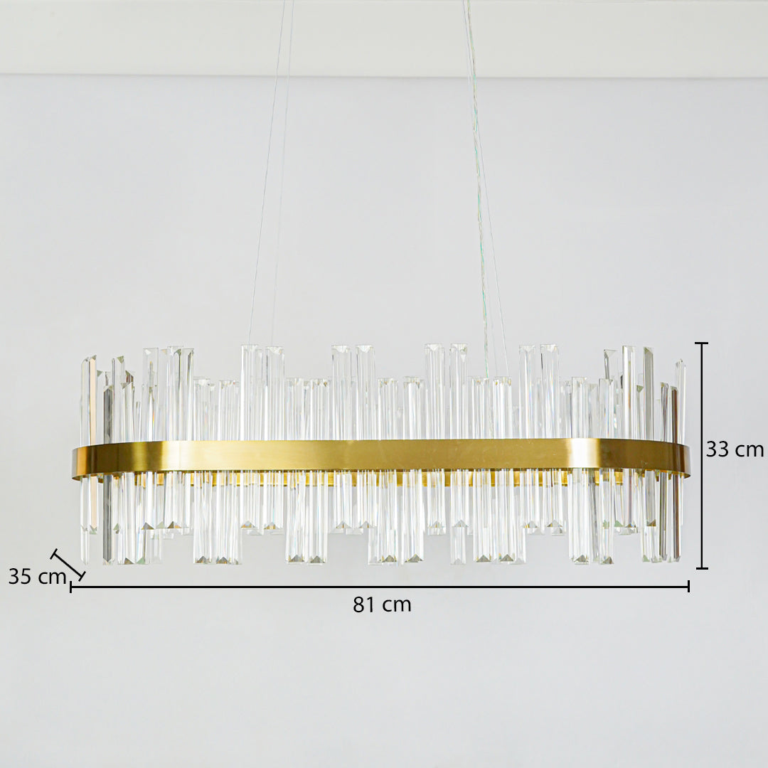 Luxury gold crystal ring chandelier with layered glass rods on white ceiling background 81 cm length 35 cm width 33 cm height ideal for modern dining space lighting.