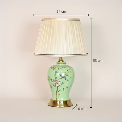 Green ceramic table lamp with floral bird design showing 53 cm height 34 cm shade width and 16 cm base size for placement.