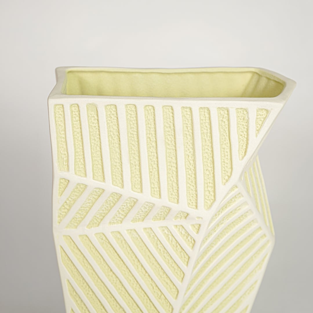 Close view of moss textured ceramic vase medium featuring sculpted organic detailing and refined matte surface.