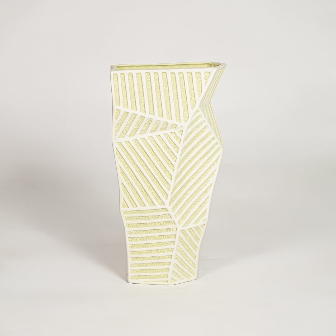 Moss textured ceramic vase medium with rounded sculpted body isolated on clean white background for contemporary decor placement.
