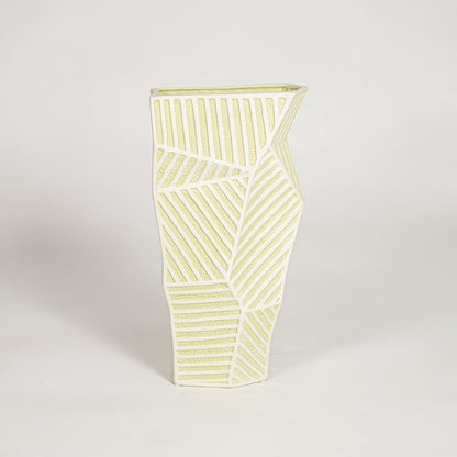 Moss textured ceramic vase medium with rounded sculpted body isolated on clean white background for contemporary decor placement.
