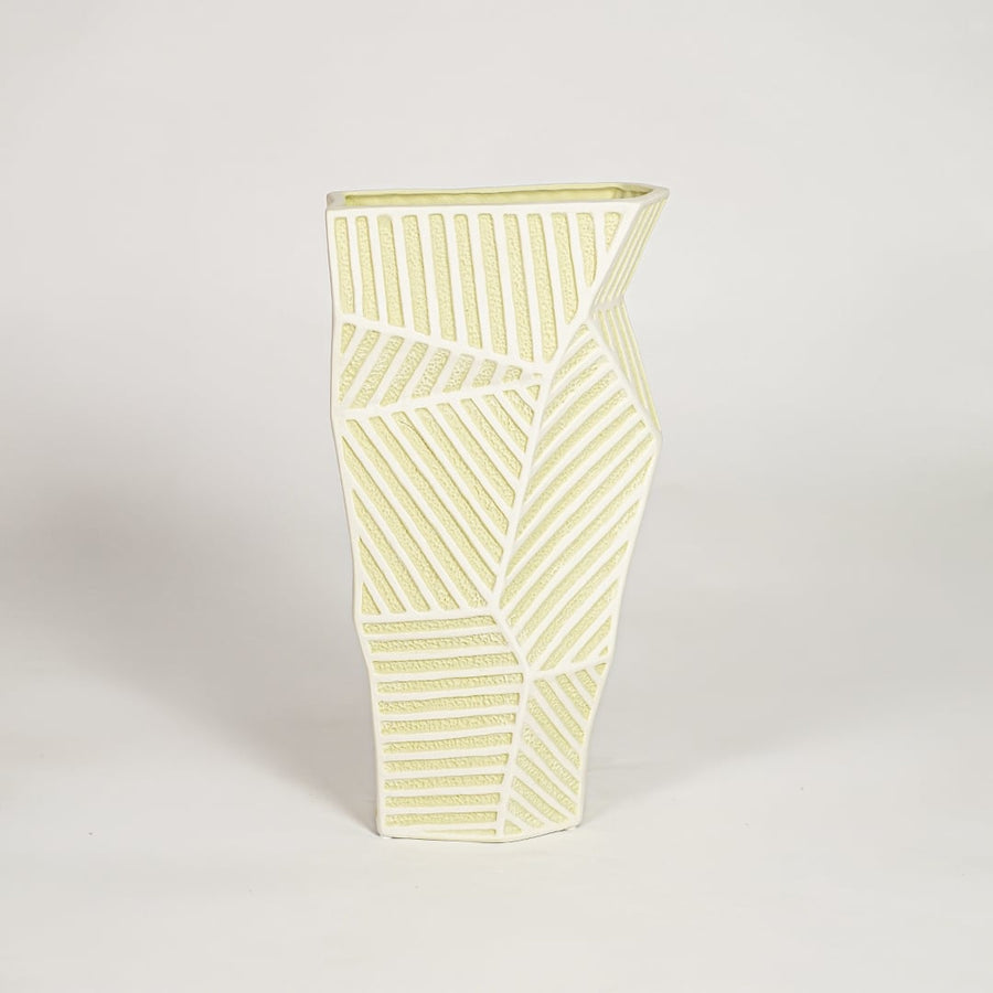 Moss textured ceramic vase medium with rounded sculpted body isolated on clean white background for contemporary decor placement.