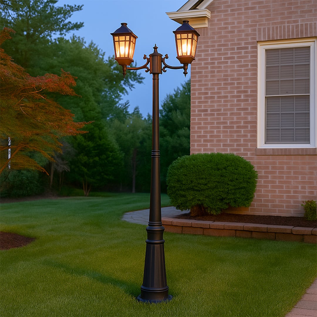 Traditional black metal dual head post lamp standing tall in outdoor garden setting creating vintage street light ambiance.