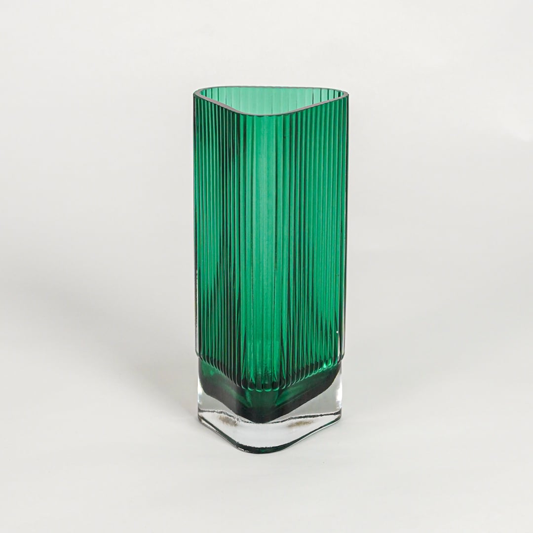 Green textured glass vase on white background modern decorative glass accent piece for table shelf console styling interior.