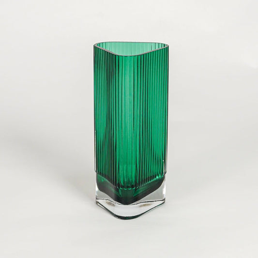 Green textured glass vase on white background modern decorative glass accent piece for table shelf console styling interior.