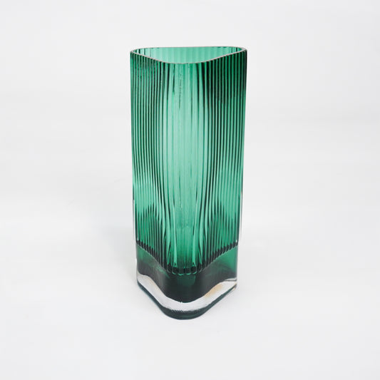 White background image of long green luxury glass vase for elegant tabletop decor styling and modern interior room design.