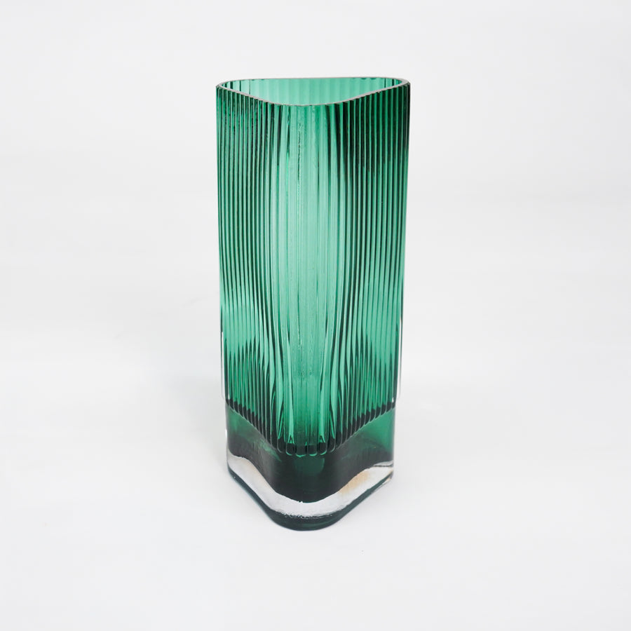 White background image of long green luxury glass vase for elegant tabletop decor styling and modern interior room design.