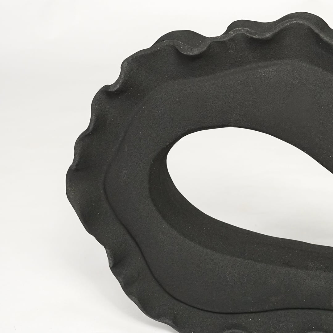 Textured dark grey ceramic abstract art sculpture for elegant shelf and console decor styling.