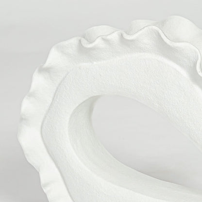 loop white ceramic decorative item closeup