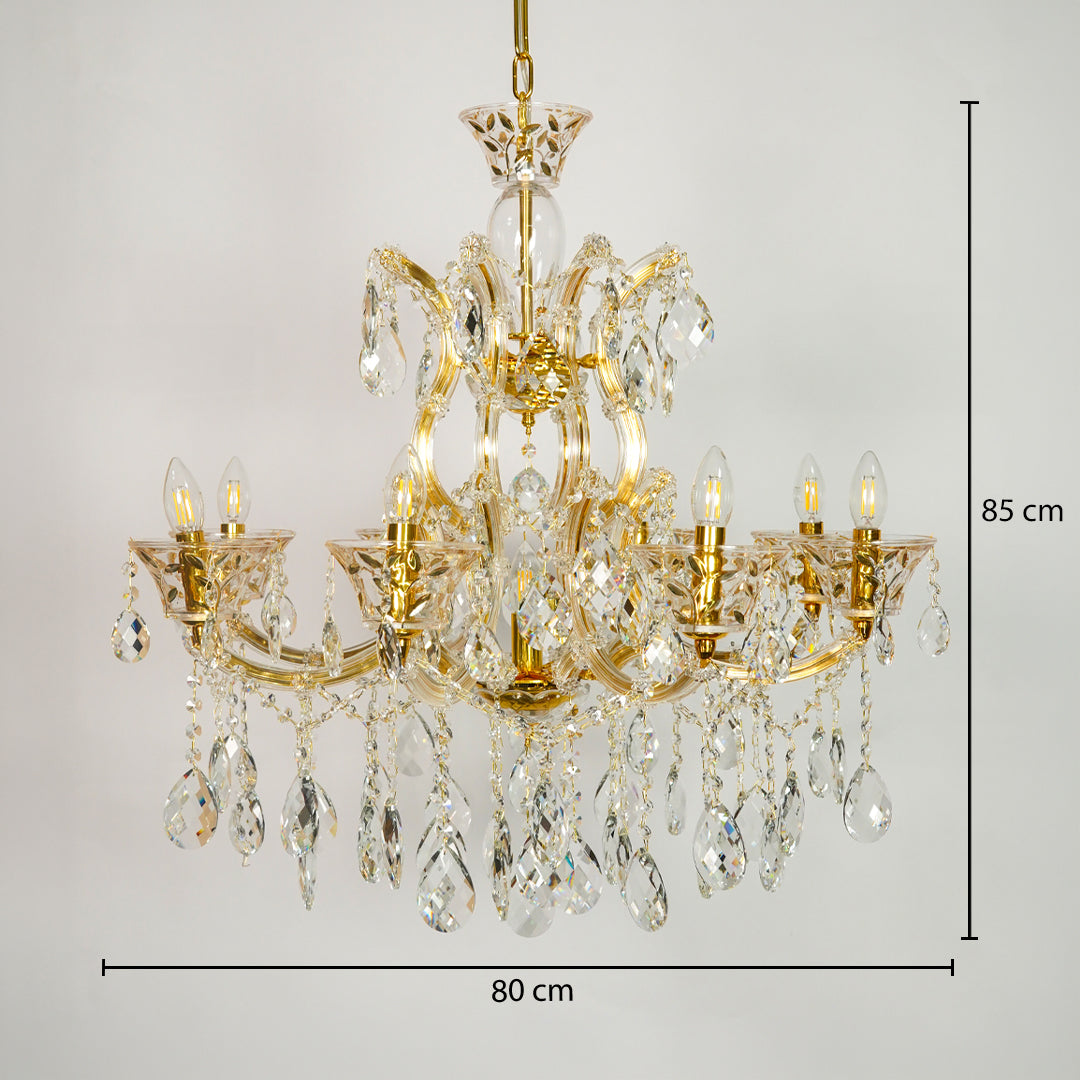 Gold-finished multi-arm chandelier with clear crystal teardrop pendants and candle-style bulbs, shown against a light gray background with dimension lines indicating 80 cm width and 85 cm height.