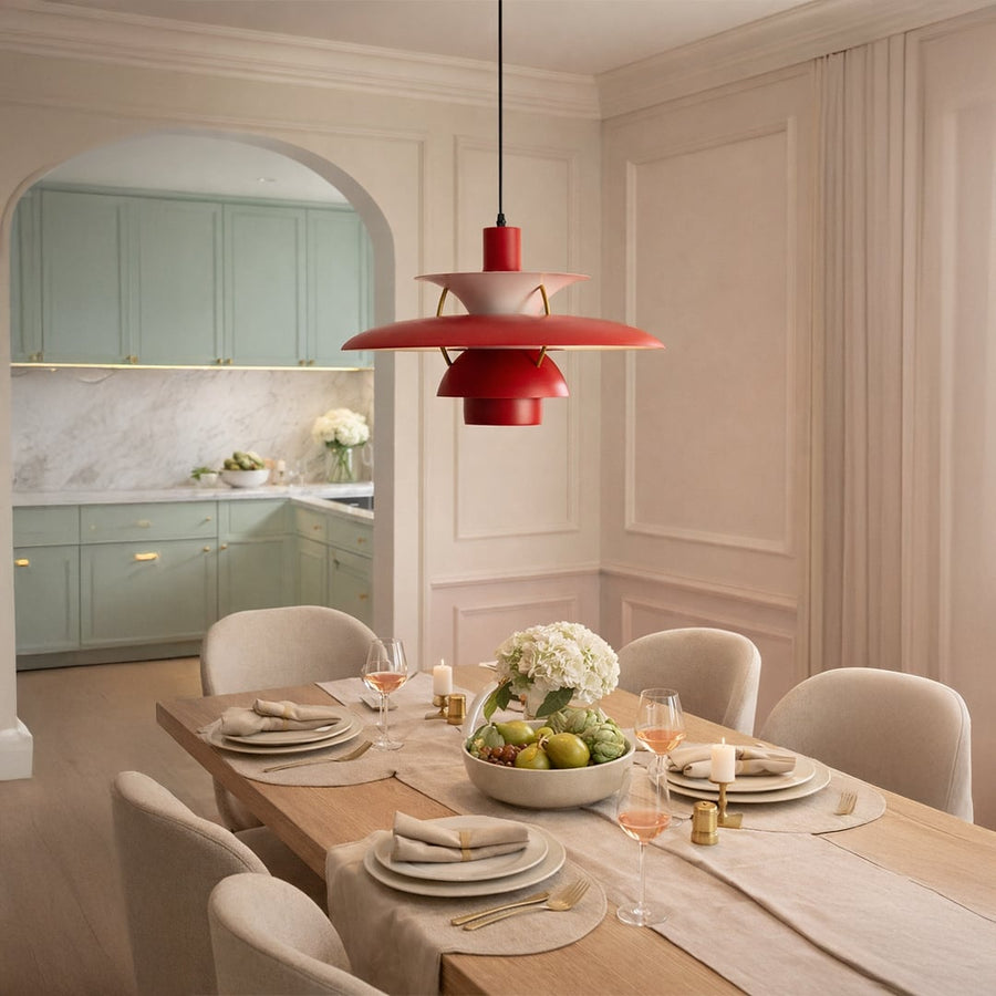 Red glass pendant light above dining table adding vibrant warmth and modern sophistication indoors.