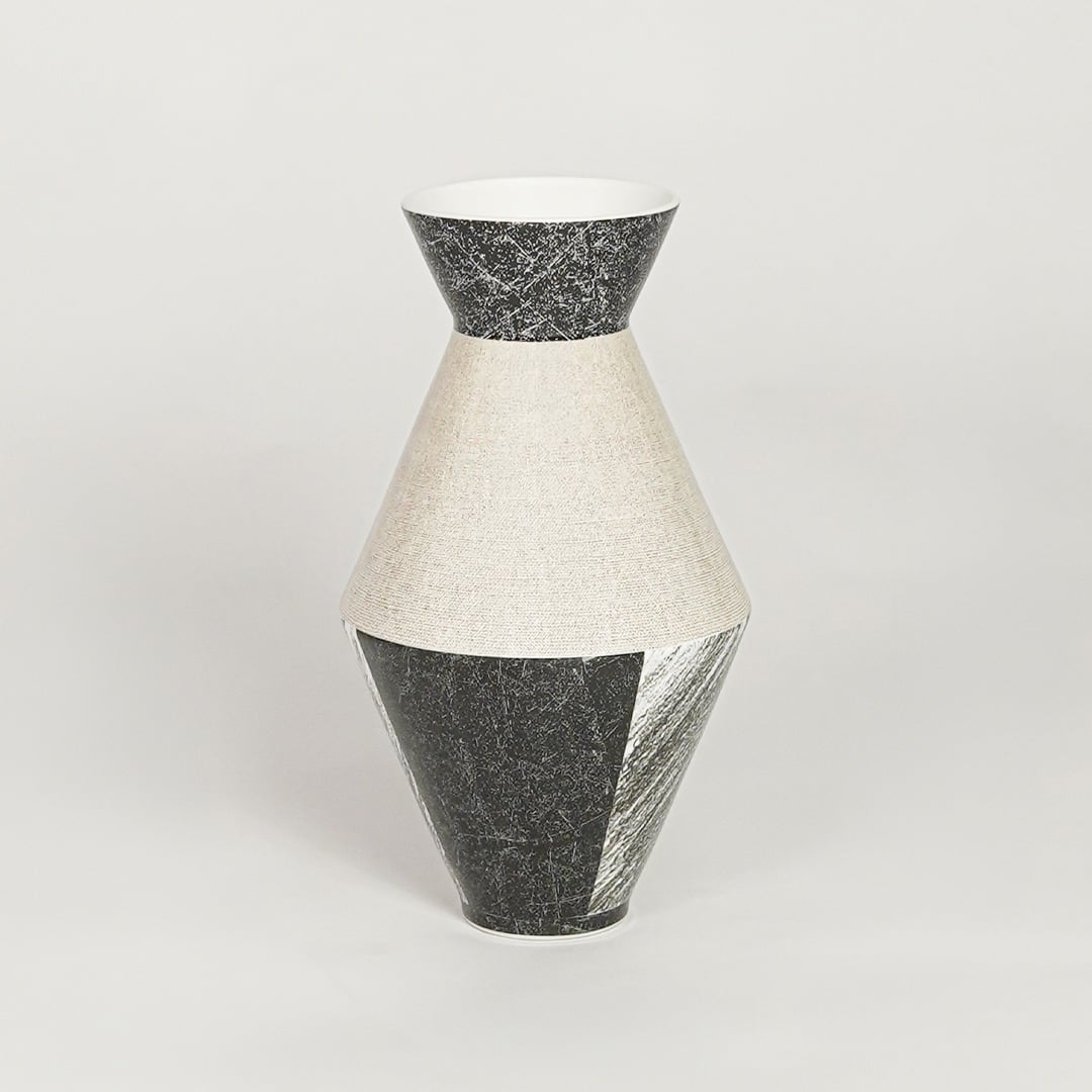 Contemporary black and white ceramic flower vase with artistic design perfect for entryway table living room decor display.
