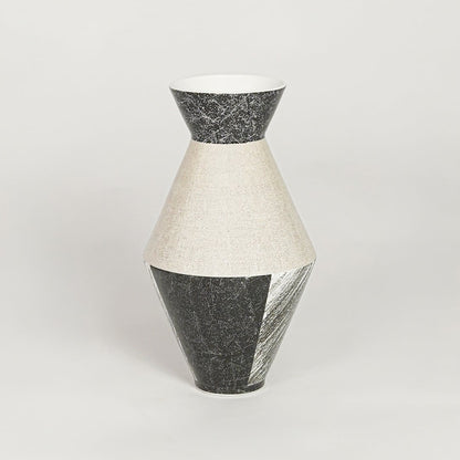 Contemporary black and white ceramic flower vase with artistic design perfect for entryway table living room decor display.