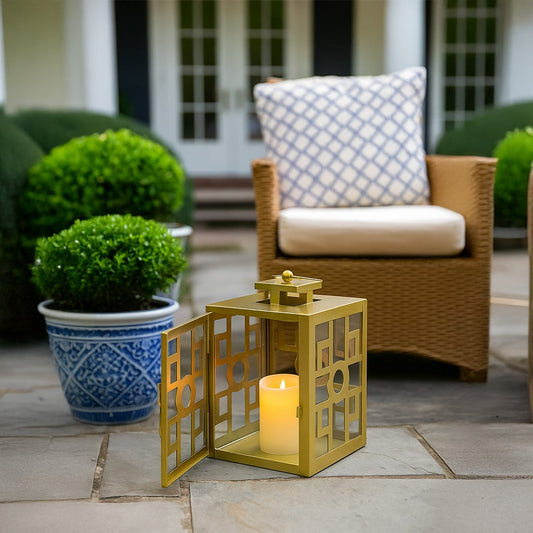 Garden seating corner styled with yellow lantern and potted plants creating inviting outdoor lounge Decor atmosphere.