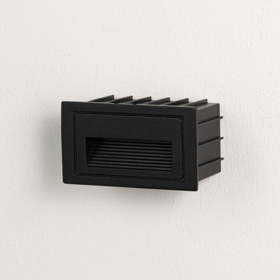 Modern black recessed step light displayed off on plain white background ideal for indoor and outdoor use.