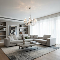 Modern chrome and clear glass chandelier adds elegant ambient lighting to living room or dining room ceilings.