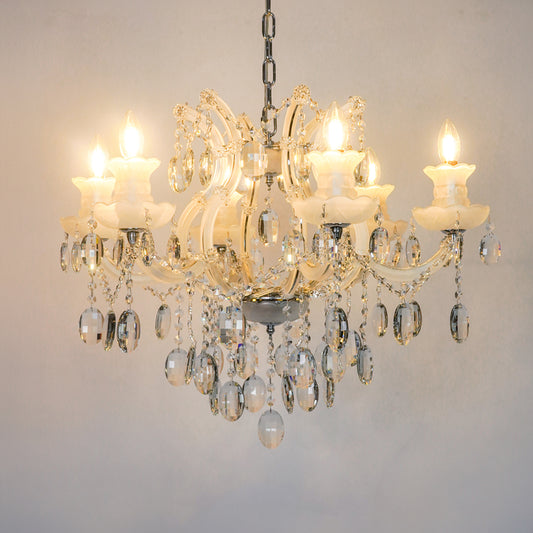 White background image of gold metal candle style chandelier for modern living room decor styling with a bright warm glow.