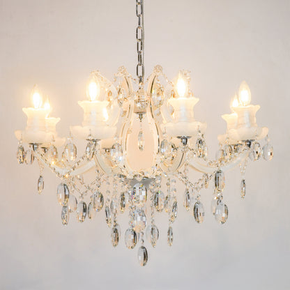 White background image of large gold metal candle style chandelier for modern living room decor styling with a bright warm glow.