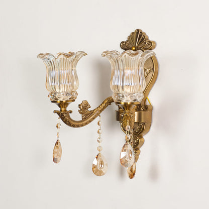 Wall light with antique gold frame and amber glass shades displayed on a white background for clear product detailing.