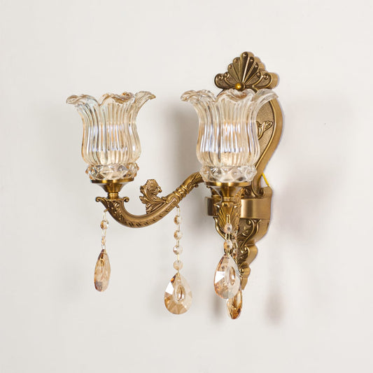 Wall light with antique gold frame and amber glass shades displayed on a white background for clear product detailing.