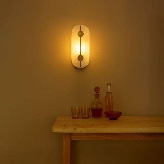 Modern marble wall light with warm ambient glow for stylish bedroom and premium decor styling spaces.

