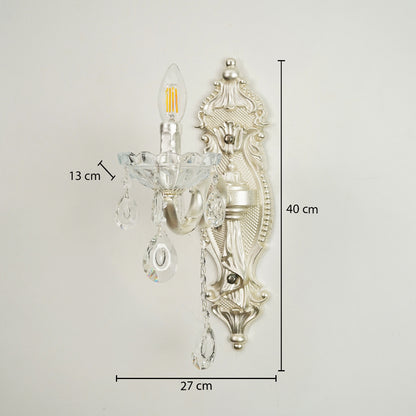 Silver wall sconce with clear glass crystal teardrop pendants, shown with dimension markings of 27 cm width, 40 cm height, and 13 cm arm depth against a plain light background.