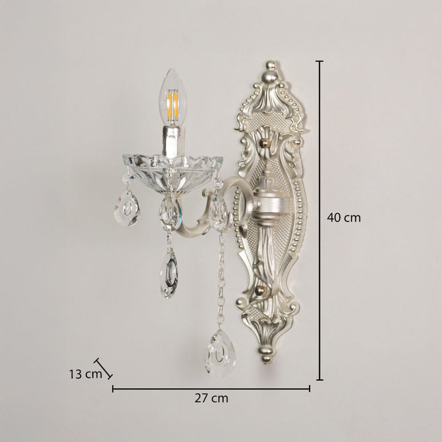 Wall light with silver metal frame and crystal droplets shown with 40 cm height and 27 cm width and 13 cm depth for accurate placement.