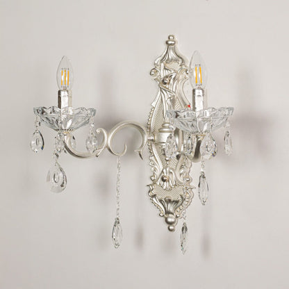 Wall light with silver metal frame and crystal accents displayed on a white background for clear refined product viewing.